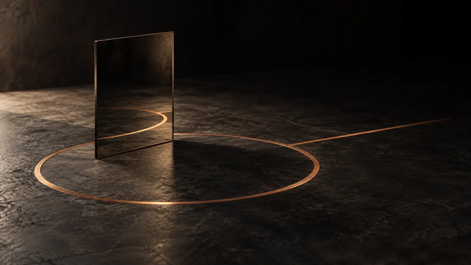 A dark mirror by a bronze loop on a stone floor, with a line continuing outward.